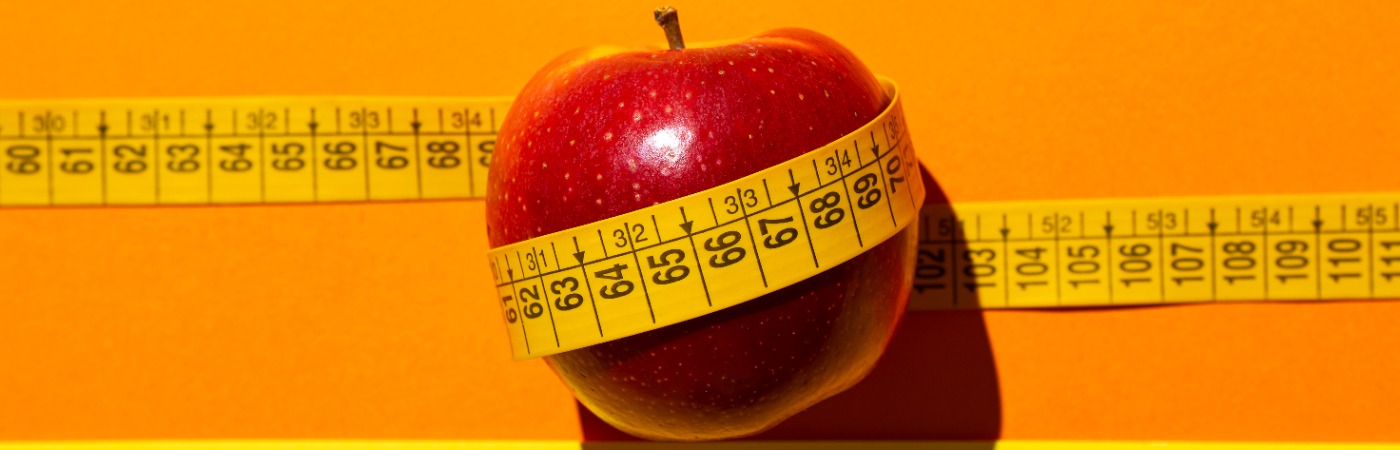 Image showing a picture of a measuring tape and apple - depicting BMI