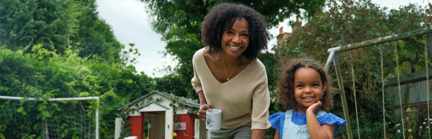 Mum and daughter in garden - decreasing life insurance