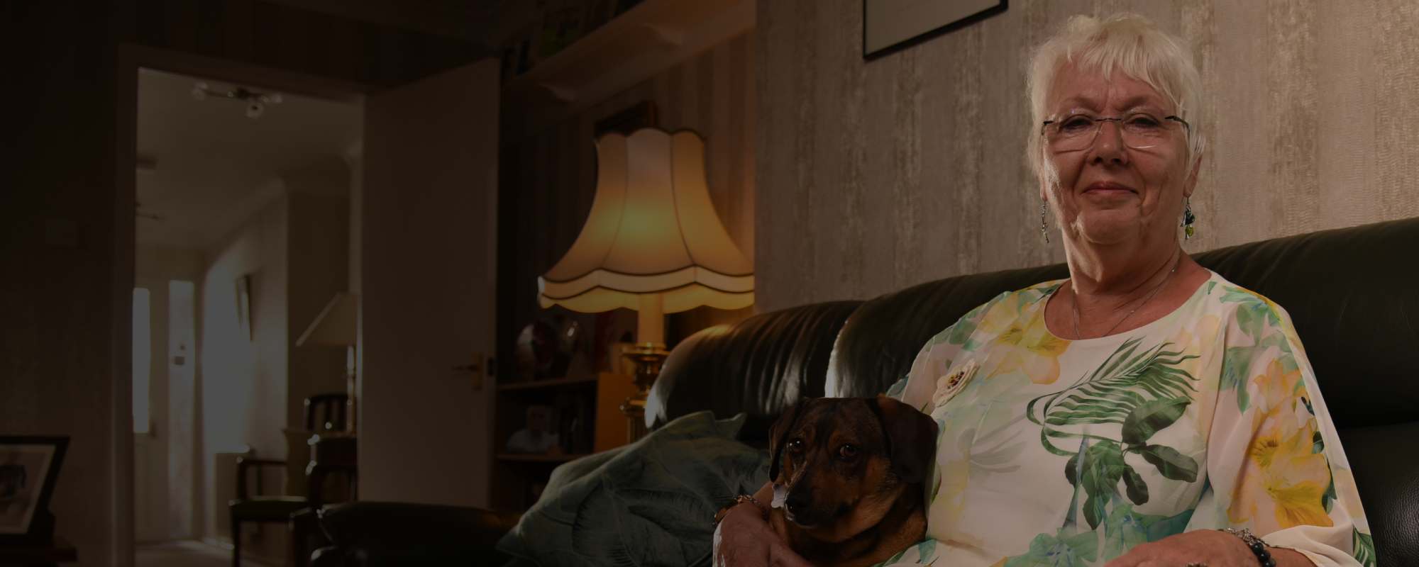 Evadne on sofa with her dog